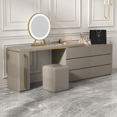 a vanity with a mirror, stool and jewelry on it in front of a white wall