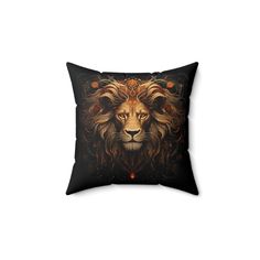 a black pillow with a lion's face on it