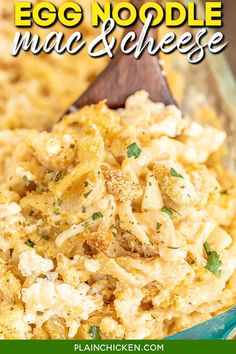 egg noodle mac and cheese in a blue bowl with a wooden spoon on the side