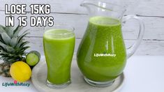 a pitcher and glass filled with green liquid