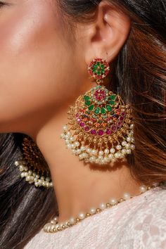 Elevate your style with the "Inaya - Statement Earrings & Maang Tikka Set." This exquisite set is a testament to timeless beauty and elegance, inspired by the classic Navratan style. Crafted with meticulous attention to detail, it offers a grandeur to leave a lasting impression.The oversized chandbali earrings and tikka are adorned with an array of stunning gems, representing the Navratnas. They are a brilliant fusion of tradition and luxury, perfect for special occasions and celebrations. Make Necklace On Lehenga, Maang Tikka Set, Ear Chain, Accessories Ear, Dangler Earrings, Chandbali Earrings, Earrings Indian, Minimal Necklace, Maang Tikka