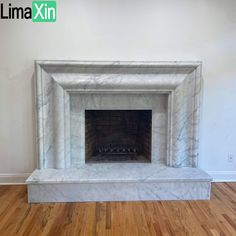 a white marble fireplace with wood flooring