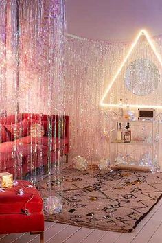 a living room filled with lots of furniture and lights on the walls, along with an area rug covered in bubbles