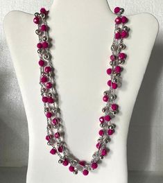 This beautiful necklace is made with round hot pink and (silver colored) beads. 58 inch in circled length. Can be worn layered. Silver Beads For Parties, Pink Jewelry With Silver Round Beads, Pink Jewelry With Silver Beads For Party, Pink Beaded Necklaces With Silver Beads For Gifts, Pink Round Beaded Necklaces For Party, Pink Round Beaded Necklaces With Faceted Beads, Pink Beaded Necklaces For Party, Pink Round Beaded Necklace With Faceted Beads, Silver Beaded Necklace With Faceted Beads