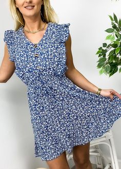 The EMES SHOP dress is detailed with a fun ditsy floral print. Features a v neck line. ruffle front design. sleeveless. button front design. flowy skirt. above knee length. Pair it with a belt and boots for a beautiful look.MATERIAL:95% Polyester 5% SpandexMEASUREMENTS: Product Length 36"-37.5"in 4-6-Small | Waist: 25"-26.5"in | Chest: 33"-34.5"in | Hips: 33.5"-35"in 6-8-Medium | Waist: 26.5"-28"in | Chest: 34.5"-36"in | Hips: 35"-36.5"in 8-10-Large | Waist: 28"-29.5"in | Chest: 36"-37.5"in | Hi V-neck Sundress With Ditsy Floral Print, Summer V-neck Sundress With Ditsy Floral Print, Ditsy Floral Print V-neck Sundress, V-neck Ditsy Floral Print Dress, Flowy Ditsy Floral Print V-neck Dress, V-neck Sundress With Ditsy Floral Print For Day Out, Casual V-neck Floral Dress With Ruffle Hem, V-neck Sundress With Buttons, Front Button Dress