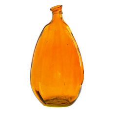 an orange glass bottle sitting on top of a white surface