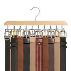 a rack with belts hanging from it's hooks and some clips attached to them