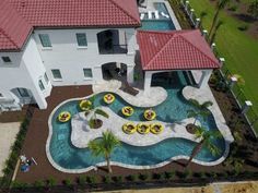 an aerial view of a house with a swimming pool