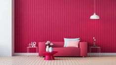 a living room with red walls and pink furniture in the center, along with white flooring