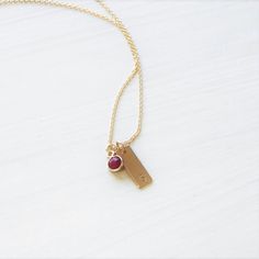 "Our initial charm necklace is a meaningful way to wear your favorite initial & birthstone close to your heart. Choose up to 3 discs paired with a ultra tiny birthstone charm. D E T A I L S -Choose from 1-3 discs & gem charm sets -Dainty rectangle measures 16mm -Chain & discs are 14kt Gold-Filled or Sterling Silver -A high quality delicate link chain -Polished to a light satin finish. CUSTOM HAND STAMPING -Hand stamped with an initial. -Classic Uppercase Block font Genuine Gemstones Sterling Silver Initial Necklace With Birthstone For Birthday, Sterling Silver Birthday Initial Necklace With Birthstone, Dainty Everyday Initial Necklace With Birthstone, Initial Pendant Birthstone Necklace For Birthday, Minimalist Birthstone Charm Necklaces For Mother's Day, Minimalist Birthstone Charm Necklace For Mother's Day, Adjustable Charm Necklace With Birthstone For Birthday Gift, Dainty Birthstone Initial Necklace For Gift, Adjustable Birthstone Charm Necklace For Birthday Gift