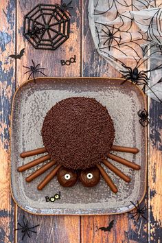 a spider cake with chocolate icing and spooky eyes