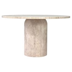 a white marble table with a circular base on an isolated white background for use as a centerpiece