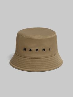 Bucket hat made from organic cotton gabardine. Embellished with embroidered Marni lettering on the front. Lined in cotton. Cotton Hats With Logo Detail And Curved Brim, Cotton Hat With Logo And Curved Brim, Cotton Curved Brim Hat With Logo Detail, Cotton Hats With Logo And Curved Brim, Beige Hat With Embroidered Logo And Short Brim, Flat Brim Cotton Hat With Logo, Cotton Short Brim Hat With Logo Patch, Cotton Hat With Logo Patch And Short Brim, Flat Heel Boots