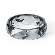 a black and white diamond ring with butterflies on it's side, against a white background