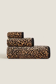 three leopard print towels stacked on top of each other