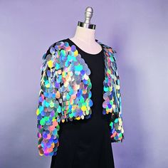 Add a whole lot of SPARKLE to your outfit with an adorable sequin jacket! This listing is for a waist or cropped length sequin jacket with white satin lining, made to order in your size. This piece differs from my sequin kimonos in its shape and sleeve style - the jacket is more fitted with a long sleeve, while the kimono has a more body shape with shorter, wider sleeves.  I can make this piece in your choice of sequin color and style. Send me a message if you are interested in customization! I would be happy to change the length, change the lining, add pockets or a hood, add satin or faux fur trim, add fringe, etc.  **If you live in the Denver area I can remove the shipping and do an in-person pickup! Spring Party Outerwear With Sequins, Sequin Disco Outerwear For Party, Disco Party Outerwear With Sequins, Disco Style Spring Party Outerwear, Spring Disco Party Outerwear, Disco Sequined Outerwear For Party, Iridescent Outerwear For Fall Party, Spring Sequin Outerwear For Costume Party, Fitted Disco Outerwear With Sequins