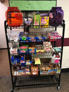 a display case filled with lots of food and snacks on it's sides in an office