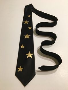 a black tie with gold stars on it