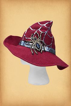 a red hat with a spider on it