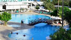 an aerial view of a swimming pool with people in it