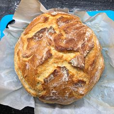 a loaf of bread sitting on top of a piece of wax paper