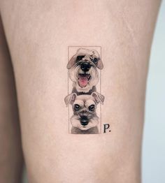 a dog and cat tattoo on the back of a woman's thigh, with her tongue out