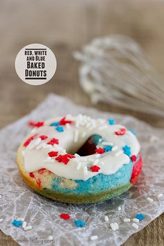 a close up of a doughnut with icing and sprinkles on it