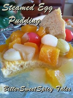 a piece of bread with fruit on it and the words steamed egg pudding written below