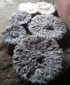 several pieces of gray and white fur on the ground