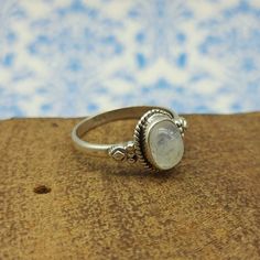 SOLnSILVER Handmade Authentic Gemstone Bohemian 925 Silver Jewelry Rainbow Moonstone Ring, Oval Gemstone Ring, 925 Solid Silver Ring, Everyday Wear Handmade Ring, Etsy Silver Cyber 2021, Rustic Gemstone Ring - Stone Polish - High - Silver Polish - High - Stone Name -  Rainbow Moonstone - Stone Shape -  Oval  - Design Shape  - Oval  - Stone Color -  Rainbow White  - Stone Category -  Cabochon - Metal - Sterling Silver - Metal Purity - 925 parts per 1000 Why To Wear Silver As a metal, silver has significant health benefits that have been used across cultures for centuries. Silver has a proven track record as a powerful antimicrobial agent fighting infections and aiding in cold and flu prevention, wound healing, and more. Silver also helps with internal heat regulation and circulation. Why To Everyday Oval Crystal Ring With Gemstone, Dainty Oval Handmade Stackable Rings, Handmade Oval Stackable Rings In Dainty Style, Handmade Dainty Oval Stackable Rings, Handmade Oval Dainty Stackable Rings, Moonstone Stackable Rings For Gift, Oval Moonstone Stackable Rings As Gift, Handmade Oval Stackable Rings For Everyday, Adjustable Oval Gemstone Stackable Rings