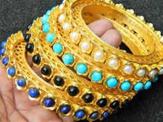 You will receive very beautiful  1 pcs Gold plated brass bangle Flower Stone bangle, Lapis Pearl black onyx & turquoise bangle, Gold plated gemstone bangle bracelet   . Metal: BrassBangle Size: 90 mmInner diameter:59 mm Many thanks for you visit my store ♥ if you have any question please contact us.For wholesale Price Please Convo me.You can order different items as many you like . Black Bangle Bracelets For Festive Occasions, Jeweled Round Bangle As Gift, Gemstone Bangle For Festivals, Festive Black Bangle Bracelet, Festive Black Bangle Bracelets, Ceremonial Stone Work Bangle Jewelry, Peacock Gold Bangles, Blue Bangle With Faceted Beads, Blue Multi-stone Bangle