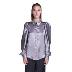 A classic shirt handcrafted in luxurious pure silk in gray tones with feminine and elegant tailoring. Embellished with mother of pearl buttons, classic collar and a soft fit. The perfect choice with our suits and skirts from the same collection. Fabric: 100% silk Dry clean only Classic collar Hidden opening center front with mother of pearl buttons Softly fitted Long sleeves with three hand-covered silk buttons Handmade to order in Italy Grey Silk Blouse, Satin Shirts, Pleather Pants, Artisan Fashion, Gray Tones, Satin Blouses, Gray Silk, Italian Fabric, Mother Of Pearl Buttons