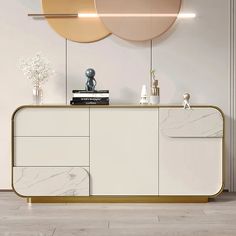 a white and gold sideboard in a living room