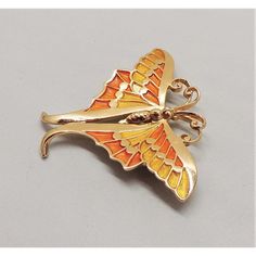 This is part of Chairish’s Costume Jewelry assortment.  Goldtone orange and yellow enamel butterfly brooch with security clasp. Marked "Napier." Measures: 2 1/8 inches long by 2 3/4 inches wide. Condition: Very good; one small section is missing yellow enamel-looks like it might have been manufactured that way- I only noticed it in the pictures as it's very small, but priced accordingly. A blue and green enamel version of this brooch was featured in a c1971 advertisement.  Please reference the m Vintage Yellow Enamel Jewelry, Vintage Orange Brooches For Gifts, Gold Butterfly Brooches For Collectors, Collectible Gold Enamel Pins, Yellow Enamel Brooches For Gifts, Retro Gold Enamel Brooches, Yellow Gold Enamel Pin Collectible, Vintage Yellow Gold Enamel Pin Collectible, Vintage Yellow Gold Enamel Pin For Collectors