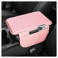 a pink case sitting on the back seat of a car