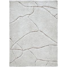 a white rug with wavy lines on it