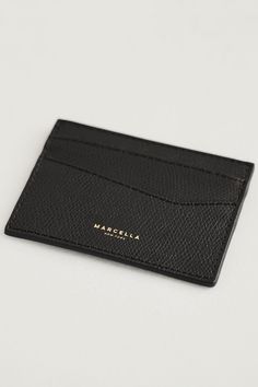 Simplify your essentials with our sleek Vincent Cardholder. This ultra-compact card wallet is crafted from pebbled Italian leather with a unique geometric design for a touch of asymmetry. Vincent includes two slots on each side to hold your cards on the go, plus a center pocket for extra storage. [SPLIT] Available in one size. Approximately 4" (10 cm) by 3" (7.5 cm). 100% Italian Leather. Wipe with a damp cloth to clean as needed. Designed in NYC. Handcrafted in Europe. Our production team enjoy Great Women, The A Team, Card Holder Leather, Grey Women, Friend Wedding, Extra Storage, Italian Leather, Card Wallet, Geometric Design