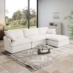 a living room with a large white sectional couch