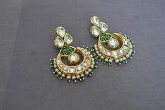 "Gorgeous Indian Kundan Chand Balis (Chandelier Earrings) embellished with Green Enmale Motifs and White Seed Pearls. They are just classy! Thrive to make a style statement at a Wedding? STYLE TIP: Pair it with a white or a gold dress and a sleek high ponytail, and you will simply stand out. Length 3.5\" Happy Shopping! FREE SHIPPING in U.S." Wedding Gold Earrings, Kundan Chandbali, Statement Earrings Wedding, Chandbali Earrings, Wedding Gold, High Ponytail, Kundan Earrings, Earrings Green, Earrings White