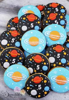 some cookies that are decorated to look like outer space