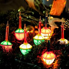 christmas lights that are sitting on top of a tree