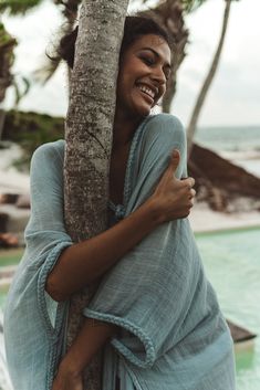 An airy, flowy, fly-away full-length duster perfect for a sunny day throw, beach cover-up, or as an outerwear accent to your favorite outfit. Trimmed with our signature braided details with a front-tie closure. Create a winged kimono-style dress by looping the braids through the arms for an adjustable robe closure. As with every Kasia Kulenty convertible collection piece, this simple-at-first-glance design can be worn to your imagination’s desire. 100% Cotton. Model is wearing hand-dyed hue Ciel Movement Pictures, Summer Outfit Accessories, Safari Outfit, Kimono Style Dress, Resort Wear Beach, Tropical Fashion, Snacks Für Party, Body Inspiration, Beach Covers