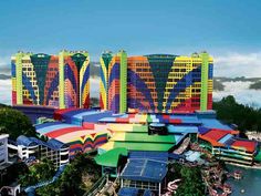 an aerial view of the resort and surrounding water features colorful umbrellas, buildings, and boats