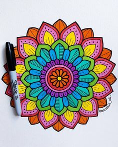 a drawing of a colorful flower with markers