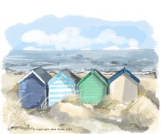 some colorful beach huts sitting in the sand