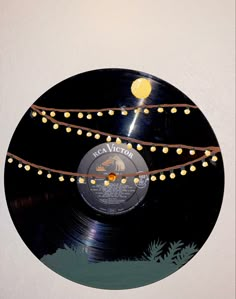 a record with string lights hanging from it