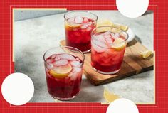 two glasses filled with red liquid and lemon slices on a cutting board next to sliced lemons