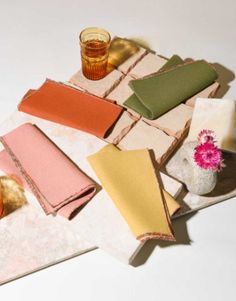 several napkins and glasses on a table