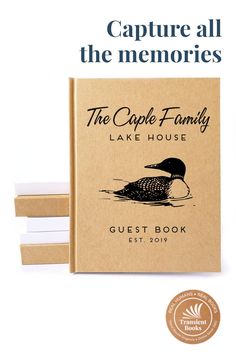 the cape family lake house guest book is shown in front of three stacks of books