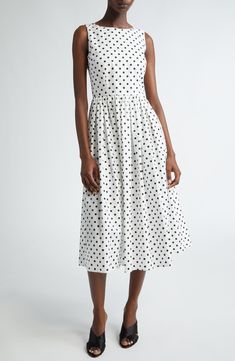 This polka-dot cotton midi dress is part of D&G's Mambo collection inspired by styles of the '40s and '50s combined with the iconography of American pin-ups. Hidden back-zip closure Scoop neck Sleeveless 100% cotton Dry clean Made in Italy Designer Clothing Chic Polka Dot Cotton Dress, Chic Cotton Polka Dot Dress, Spring Cotton Midi Dress In Polka Dot, Spring Polka Dot Cotton Midi Dress, Summer Cotton Polka Dot Midi Dress, Polka Dot Midi Dress For Daywear, Cotton Polka Dot Midi Dress For Summer, Classic Polka Dot Dress For Spring, Polka Dot Midi Length Daywear Dress